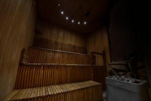 a sauna with a bench at Arti Minijos - mažoji salė in Priekulė