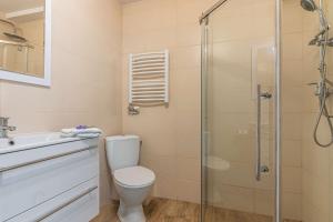 a bathroom with a shower and a toilet and a sink at Willa Sole in Busko-Zdrój +32 photos