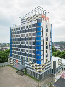 a large building with a hotel sign on it at Wahid Prime Hotel Salatiga in Salatiga