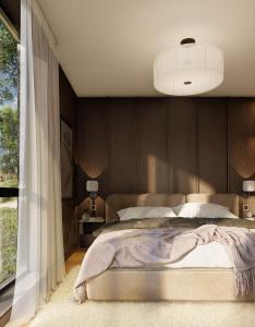 a bedroom with a large bed and a large window at Fredvang Lodge, Lofoten in Hovdan