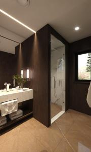 a bathroom with a sink and a shower at Fredvang Lodge, Lofoten in Hovdan +7 photos