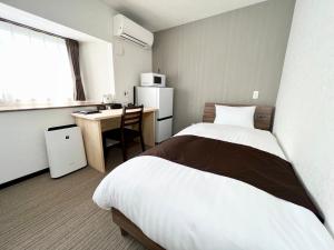 Η κουζίνα ή μικρή κουζίνα στο ゲストハウスイコット種子島