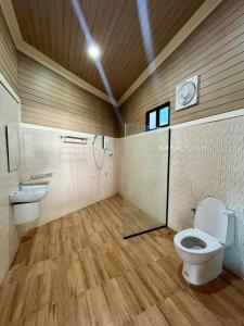 a bathroom with a toilet and a sink at Cocoloco Pool Villa Ao nang in Ban Khlong Son
