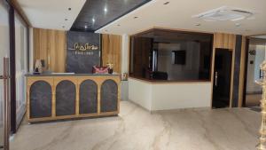 a store with a counter in a room at Sivashree Residency in Tiruvannāmalai