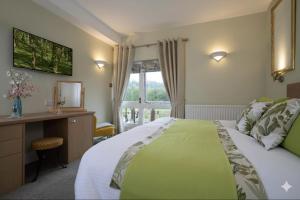 Ένα ή περισσότερα κρεβάτια σε δωμάτιο στο Brantholme Bed & Breakfast