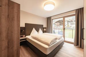 Ένα ή περισσότερα κρεβάτια σε δωμάτιο στο Kristall Apartments