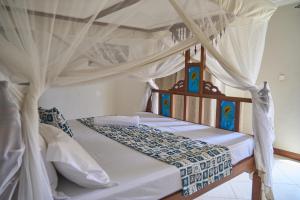 Postel nebo postele na pokoji v ubytování Garden Villa