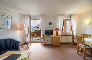 Μια τηλεόραση ή/και κέντρο ψυχαγωγίας στο Fackler Apartments am Tegernsee
