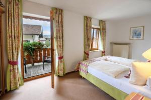 Ένα ή περισσότερα κρεβάτια σε δωμάτιο στο Fackler Apartments am Tegernsee