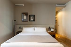 Ένα ή περισσότερα κρεβάτια σε δωμάτιο στο Colectia Stays Pau Claris