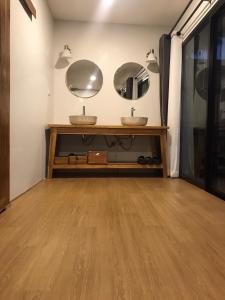 two sinks in a bathroom with two mirrors at Cozy Homey Doichang in Ban Muang Ngam +74 photos