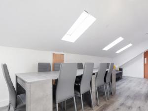 a dining room with a table and chairs at Room 1 At The Cwtch in Chepstow