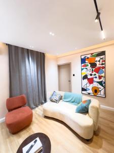 Ένα ή περισσότερα κρεβάτια σε δωμάτιο στο Citi Residence