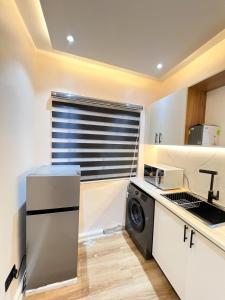 Η κουζίνα ή μικρή κουζίνα στο Citi Residence +4 φωτογραφίες