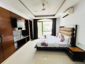 Ένα ή περισσότερα κρεβάτια σε δωμάτιο στο Hotel Golden Residency