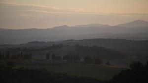 a view of a valley with mountains in the distance at Agriturismo Borgo d'Asso in San Giovanni dʼAsso