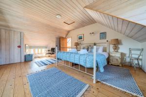 En eller flere senge i et værelse på The Dairy Barn 3 bedrooms