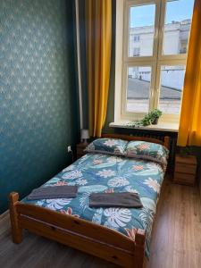 Postel nebo postele na pokoji v ubytování Oliwka Hostel