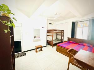 Postel nebo postele na pokoji v ubytování Surasa Beach Resort