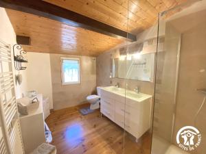 a bathroom with a sink and a toilet at Dame nature in La Tourette-Cabardès +64 photos