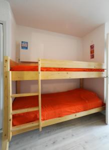 Postel nebo postele na pokoji v ubytování Résidence de Tourisme l'Albatros