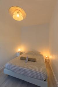 Ένα ή περισσότερα κρεβάτια σε δωμάτιο στο appartement entre plages et centre historique