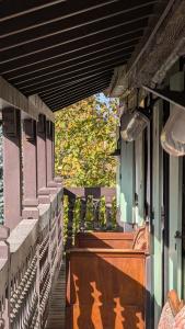 a porch of a house with plants on it at Les Perles du Ried - Gîte 202 in Boofzheim