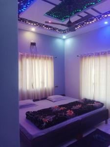 Ένα ή περισσότερα κρεβάτια σε δωμάτιο στο Rawat ji Homestay