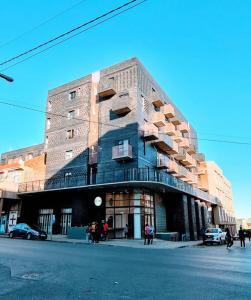 a building on the corner of a street at Stylish Bachelor with Oak Floors & View in Johannesburg