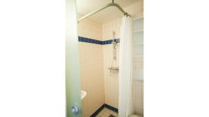 a bathroom with a shower and a sink at Bettenburg Hotel Hamburg in Hamburg