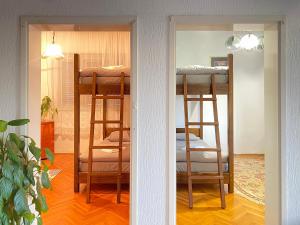 a room with two bunk beds in a room at Small Hill Guesthouse in Podgorica
