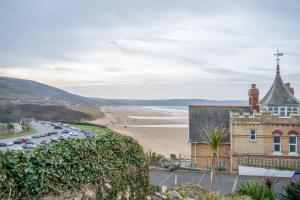 an old building on the side of a beach at Stones Throw in Woolacombe