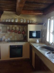 a kitchen with a sink and a counter top at La Grange in Cruis