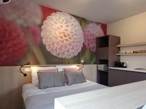 a bedroom with a bed with a large ball on the wall at aan de Dreef in Zundert