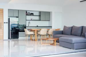 a living room with a couch and a table at Sea View Chaweng Noi Villa Luxury in Chaweng Noi Beach