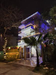 a building with blue lights on it at night at Sky Light Inn Hotel in Gurgaon