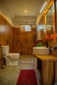 a bathroom with a toilet and a sink at Tunnel Top Inn Ella in Ella +91 photos