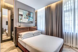 Postel nebo postele na pokoji v ubytování Hotel Viminale + 41 fotografií