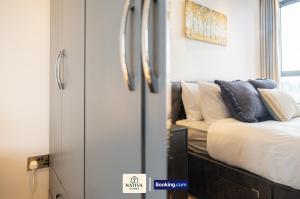 a living room with a couch and a window at Spacious 2BR, 2BA Apt By Nativa Homes Short Lets & Serviced Accommodation Harrow With Fast WiFi, Kitchen in Harrow +31 photos