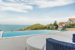 a view of the pool from the balcony of a villa at Sea View Chaweng Noi Villa Luxury in Chaweng Noi Beach