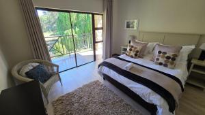 Postel nebo postele na pokoji v ubytování Pond End Villa