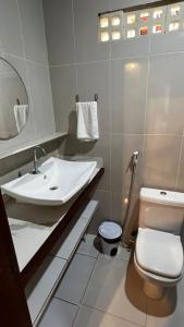 a bathroom with a sink and a toilet at Pousada Solar de Maria e Hostel in Baixa de São Francisco
