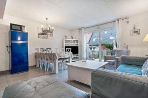 a living room with a couch and a table at Ostsee in Pruchten