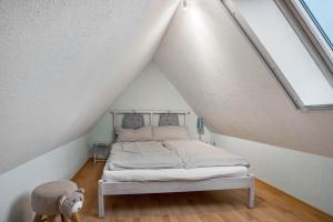 a bedroom with a bed in a attic at Ostsee in Pruchten