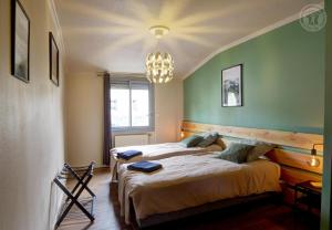 Ένα ή περισσότερα κρεβάτια σε δωμάτιο στο Plenitude +14 φωτογραφίες