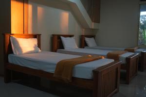 Postel nebo postele na pokoji v ubytování Sai Dham Room Stay-01