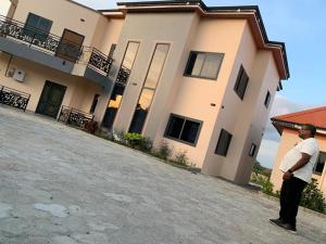 a man standing in front of a large building at BethelAirbnb  +1 photo