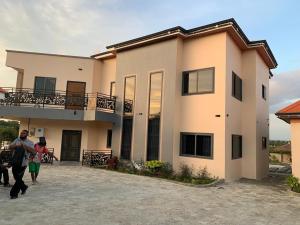 a group of people walking in front of a house at BethelAirbnb 
