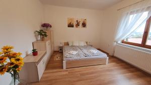 Ένα ή περισσότερα κρεβάτια σε δωμάτιο στο Pihenőház