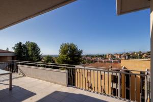 a balcony with a view of a building at Cardarelli Loft Macerata in Macerata